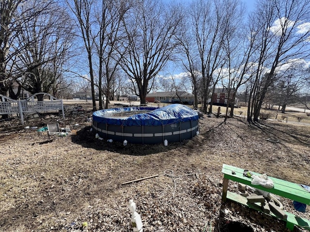 view of yard featuring a covered pool