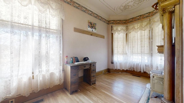 office space with light wood-type flooring