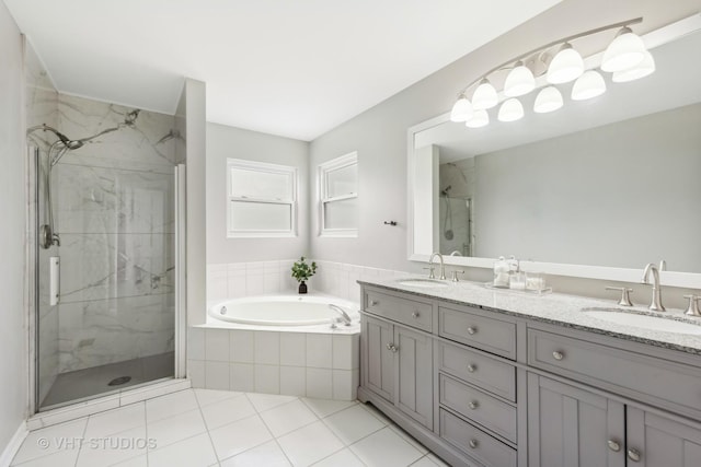 full bathroom featuring a bath, double vanity, a sink, and a marble finish shower