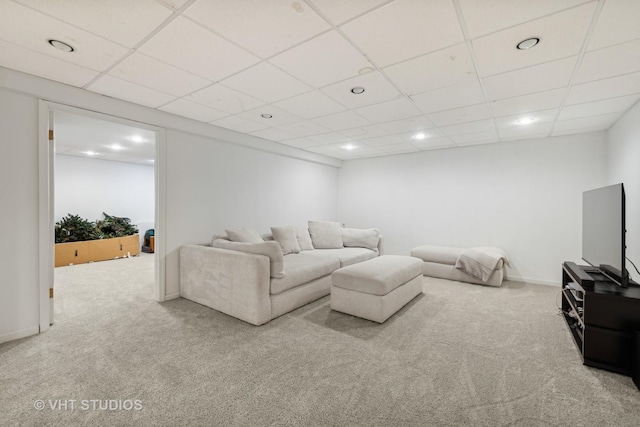 living area with light carpet, recessed lighting, a paneled ceiling, and baseboards