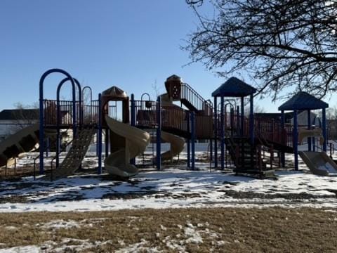 snow covered playground with a playground