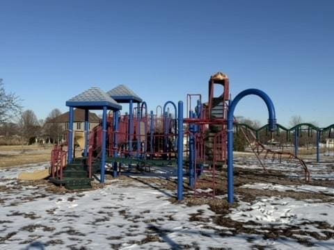 snow covered playground featuring playground community