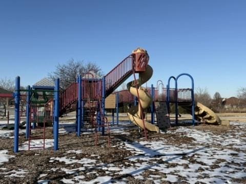 snow covered playground with playground community