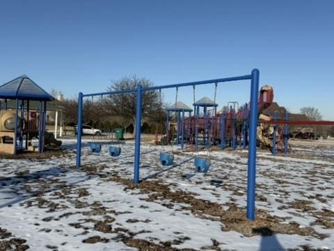 snow covered playground featuring playground community