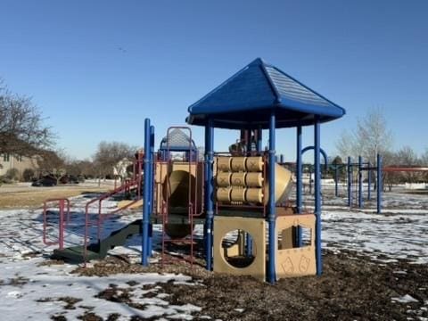 snow covered playground with playground community