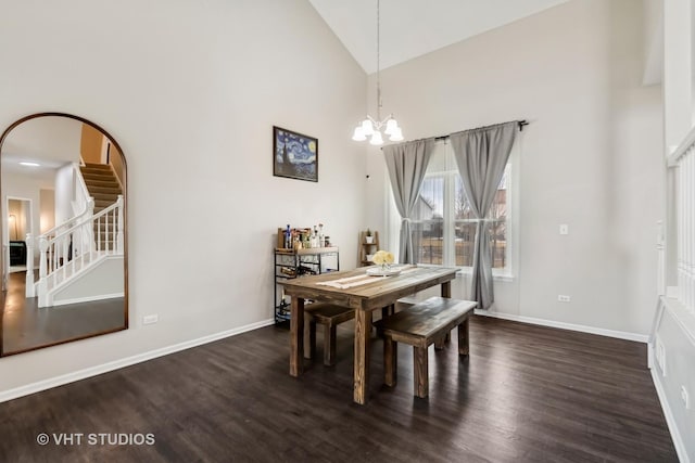 dining room featuring a chandelier, stairway, baseboards, and dark wood-style floors