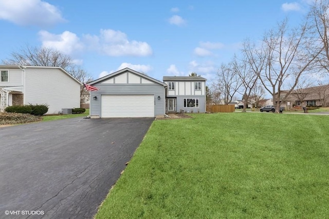 view of front of home with a garage, a front yard, driveway, and central air condition unit