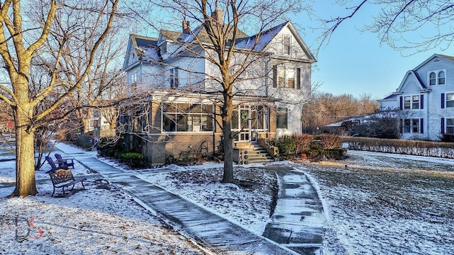 view of front of house with brick siding