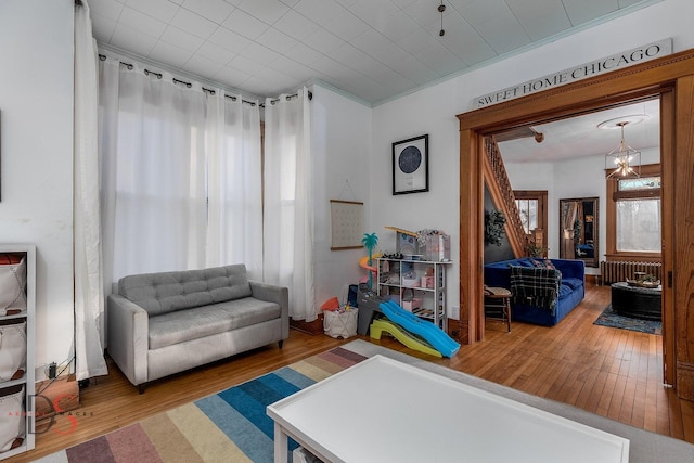 interior space featuring radiator heating unit and wood finished floors