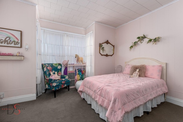 carpeted bedroom featuring ornamental molding and baseboards