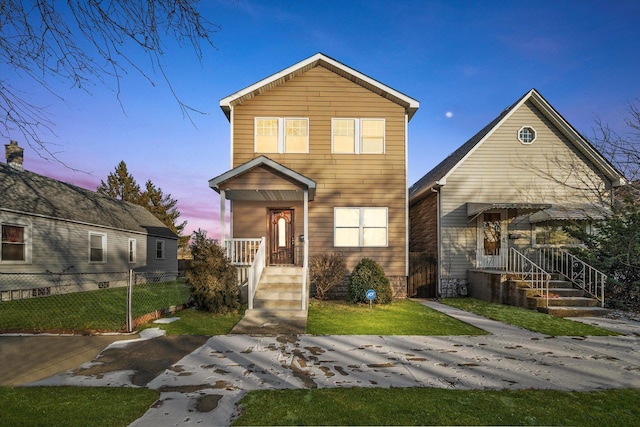 view of front of house with fence