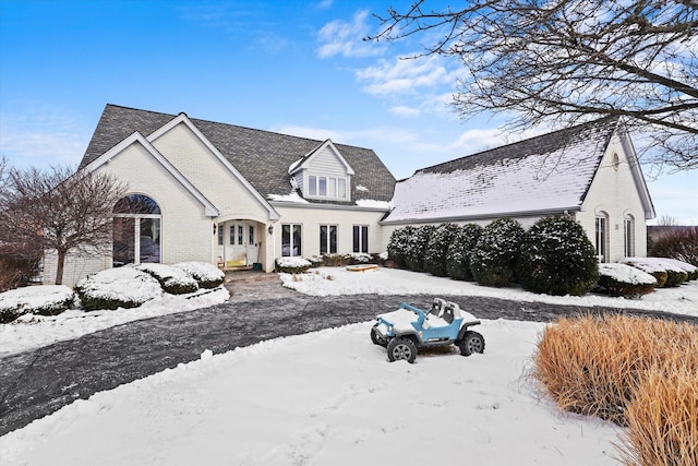 view of front of home featuring brick siding