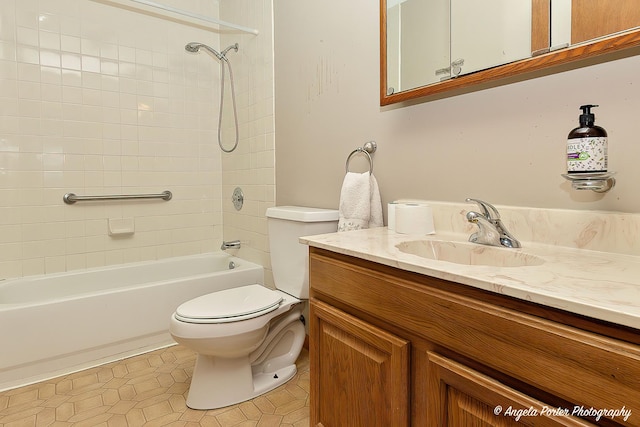 bathroom featuring bathing tub / shower combination, vanity, and toilet