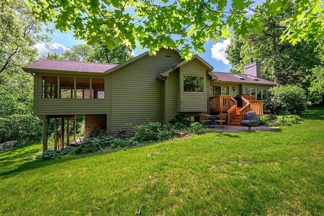 18 Colony Ln, Galena, IL 61036 - back of house featuring a lawn, a wooden deck, a chimney, and a patio area