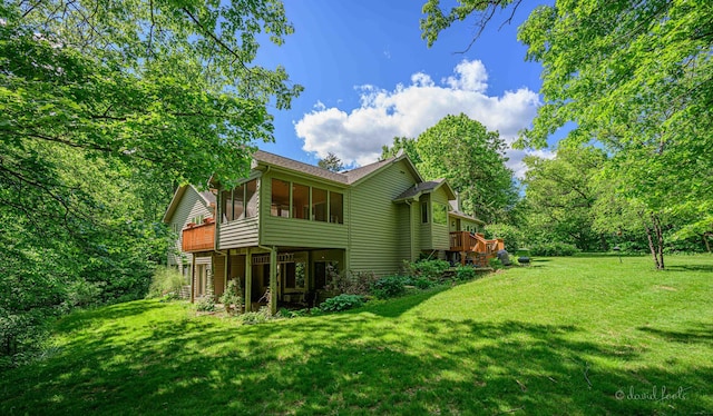 18 Colony Ln, Galena, IL 61036 - back of property featuring a sunroom, a lawn, and a wooden deck