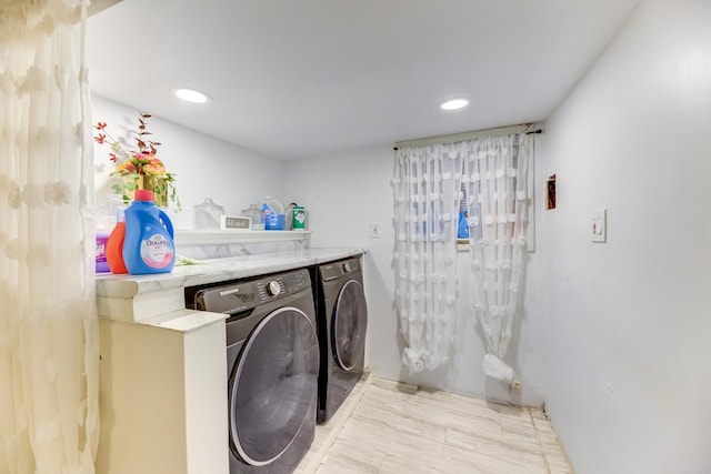 laundry area with laundry area, washing machine and dryer, and recessed lighting