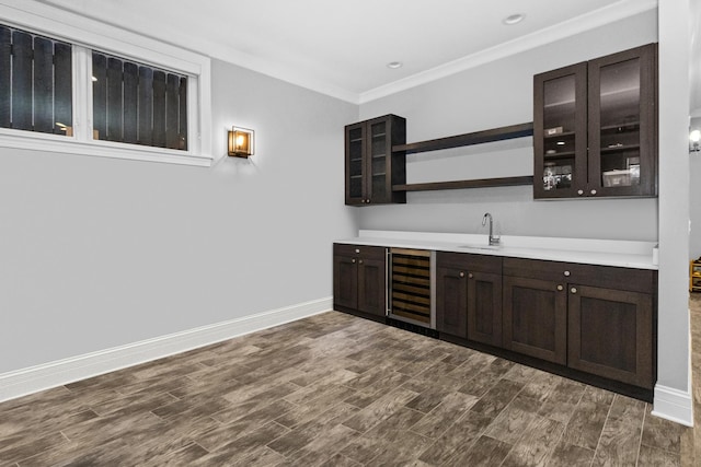 bar featuring a sink, wine cooler, wet bar, and dark wood-style flooring