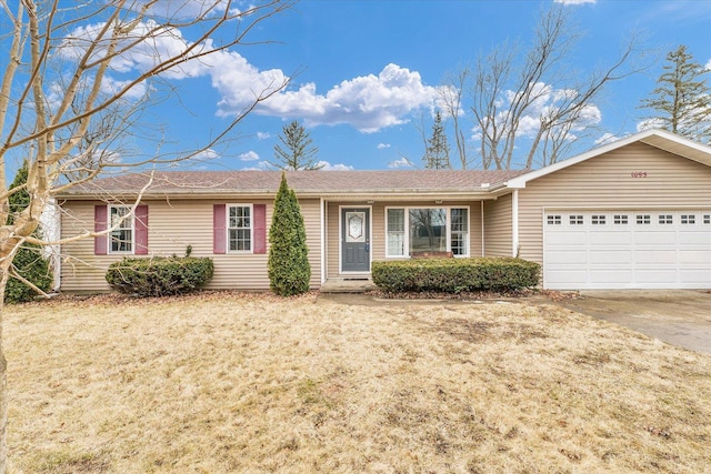 ranch-style house with driveway and an attached garage