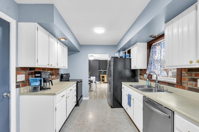 1695 Willowdale Dr, Saint Joseph, IL 61873 - kitchen with black appliances, white cabinetry, and a sink