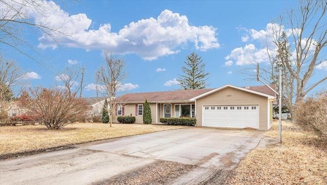 1695 Willowdale Dr, Saint Joseph, IL 61873 - ranch-style home with a front yard, concrete driveway, and an attached garage