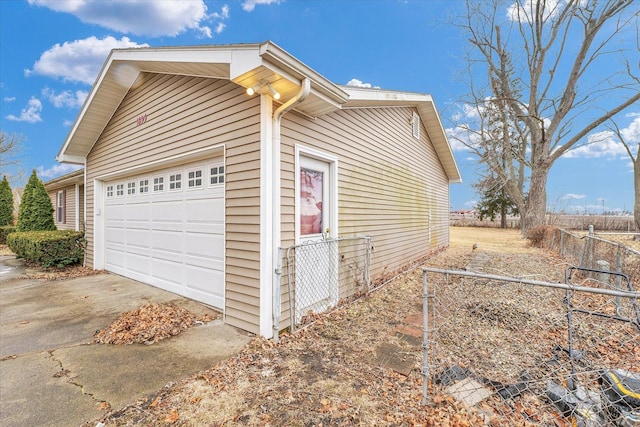 1695 Willowdale Dr, Saint Joseph, IL 61873 - view of side of property featuring a garage and fence
