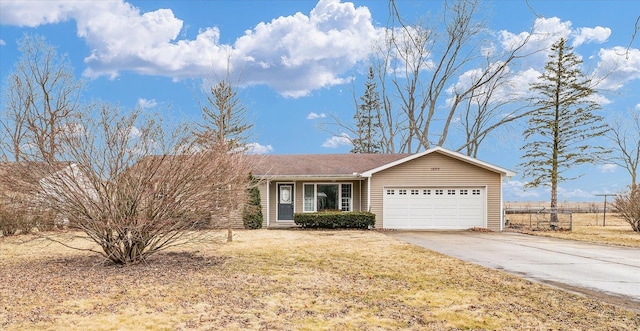 1695 Willowdale Dr, Saint Joseph, IL 61873 - single story home with an attached garage, fence, a front lawn, and concrete driveway