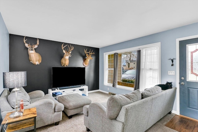 1695 Willowdale Dr, Saint Joseph, IL 61873 - living room with plenty of natural light, wood finished floors, visible vents, and baseboards
