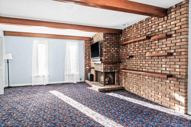 unfurnished living room featuring a textured ceiling, baseboards, a brick fireplace, beam ceiling, and carpet