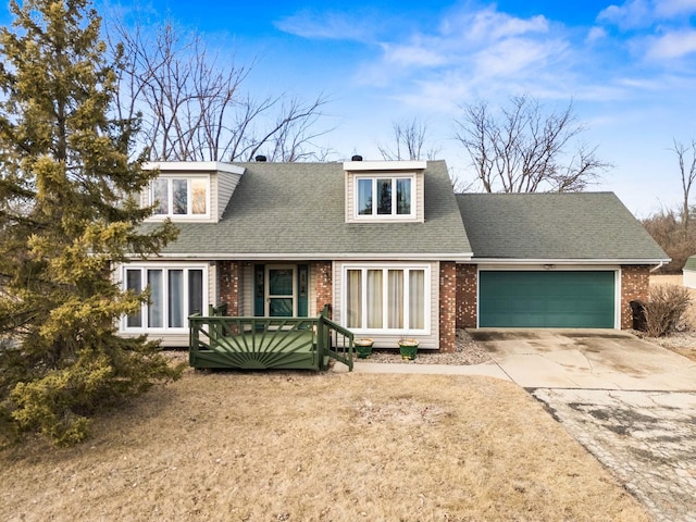 view of front of property with driveway, brick siding, an attached garage, and a shingled roof