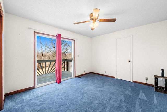 carpeted empty room featuring a textured ceiling, baseboards, and a ceiling fan