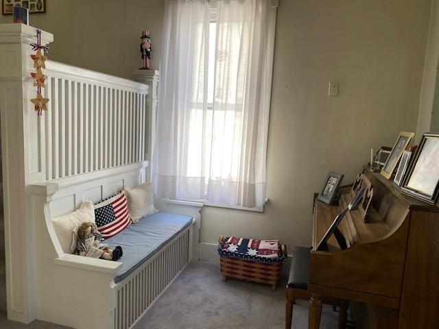 bedroom with light colored carpet