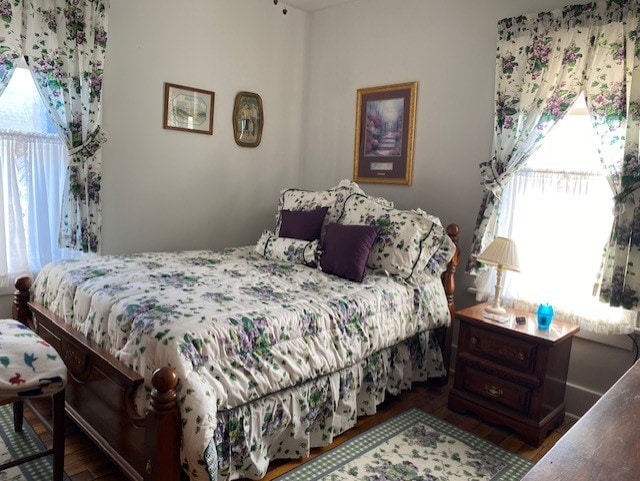 bedroom with wood finished floors