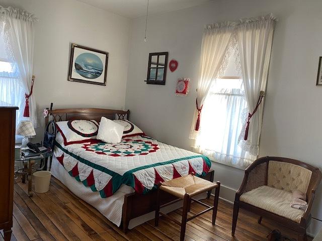 bedroom with wood finished floors