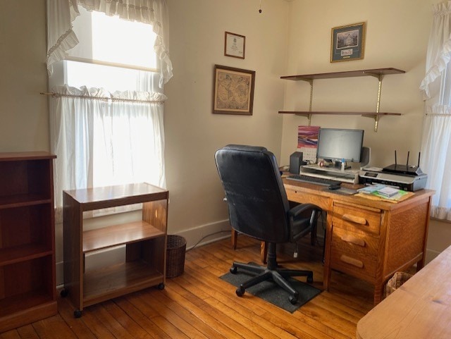 office with baseboards and wood finished floors