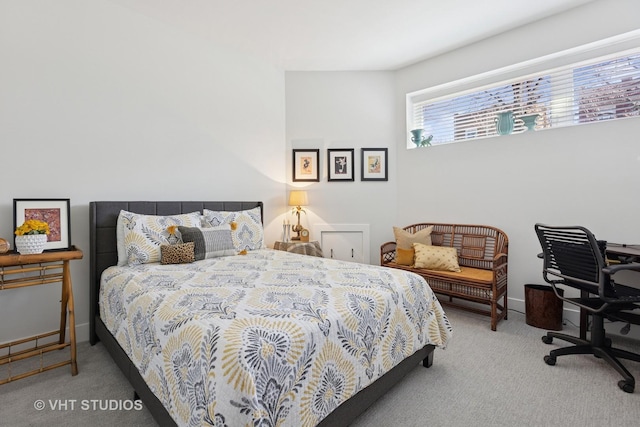 bedroom with carpet flooring and baseboards