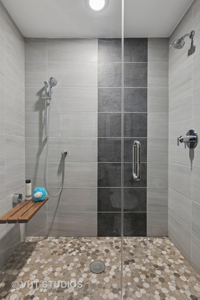 bathroom with a shower stall