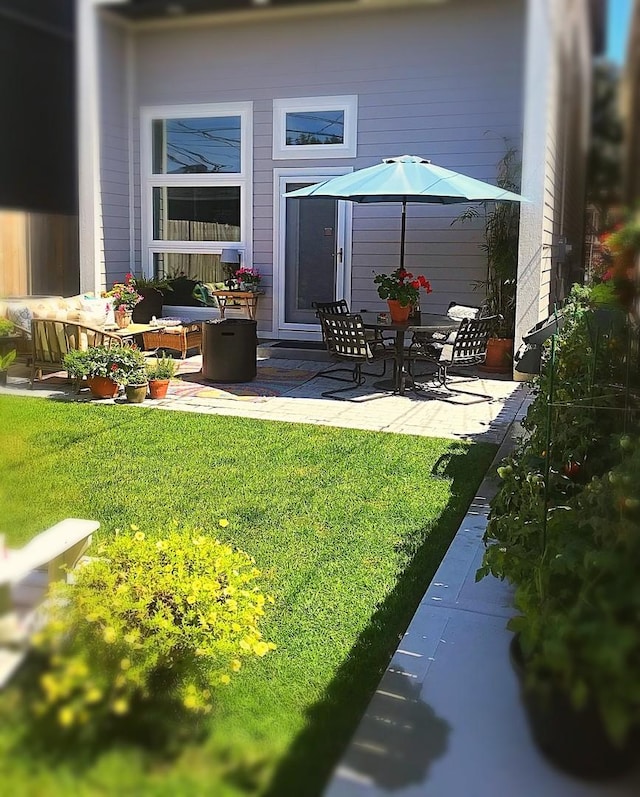 exterior space with a patio and outdoor lounge area