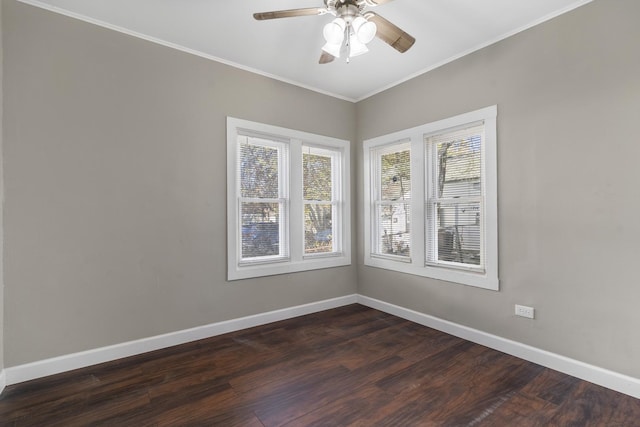 unfurnished room with dark wood-style floors, a ceiling fan, baseboards, and crown molding