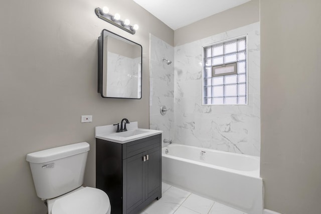 full bathroom featuring washtub / shower combination, marble finish floor, vanity, and toilet