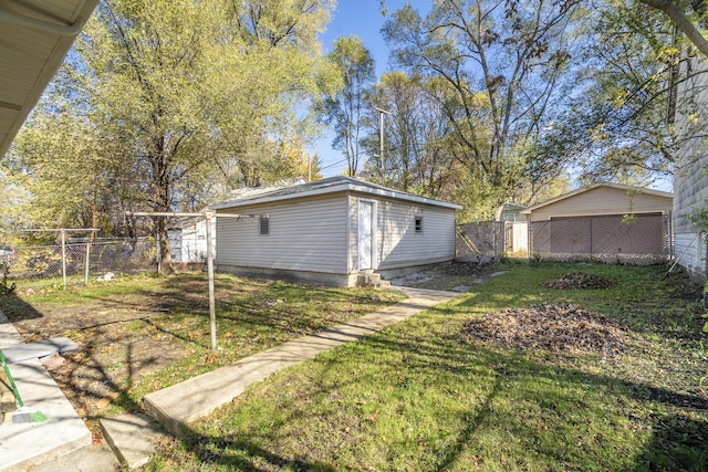 view of yard featuring an outbuilding and fence