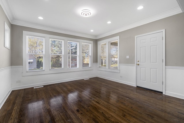 interior space with crown molding, dark wood-type flooring, a wealth of natural light, and recessed lighting