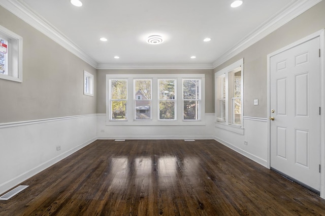 interior space with recessed lighting, visible vents, dark wood-type flooring, and ornamental molding