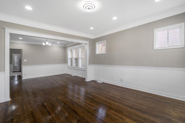 spare room with ornamental molding, dark wood-type flooring, baseboards, and recessed lighting