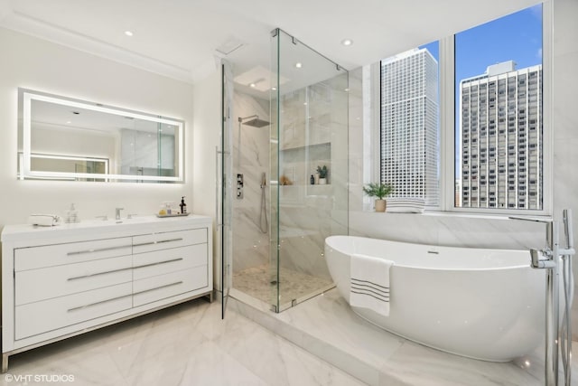 bathroom featuring a freestanding tub, marble finish floor, ornamental molding, a marble finish shower, and a view of city