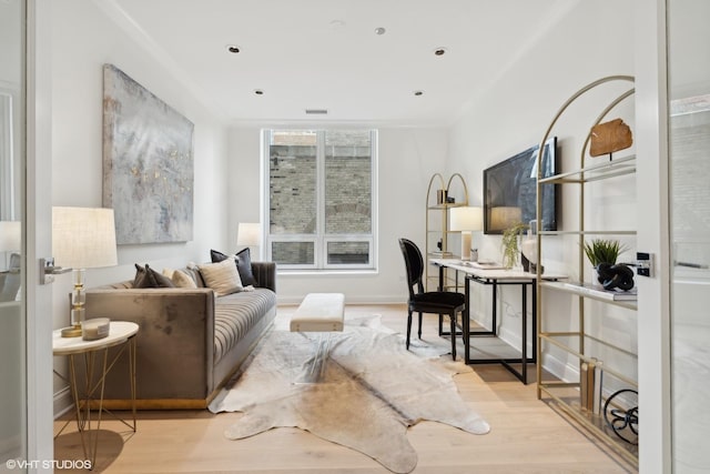 sitting room with light wood finished floors, baseboards, and recessed lighting