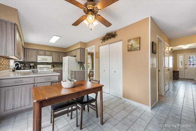 631 Alice Ct, Elgin, IL 60123 - kitchen with white appliances, backsplash, a ceiling fan, light countertops, and gray cabinetry