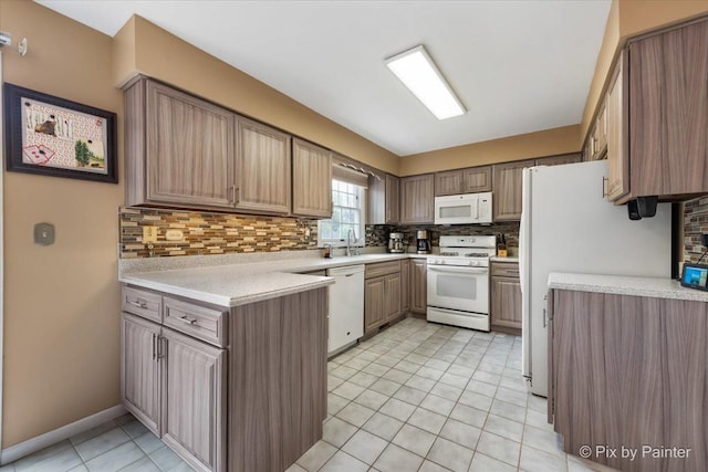 631 Alice Ct, Elgin, IL 60123 - kitchen featuring white appliances, a sink, tasteful backsplash, light countertops, and light tile patterned floors