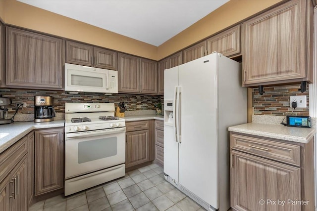 631 Alice Ct, Elgin, IL 60123 - kitchen featuring white appliances, backsplash, light tile patterned flooring, and light countertops