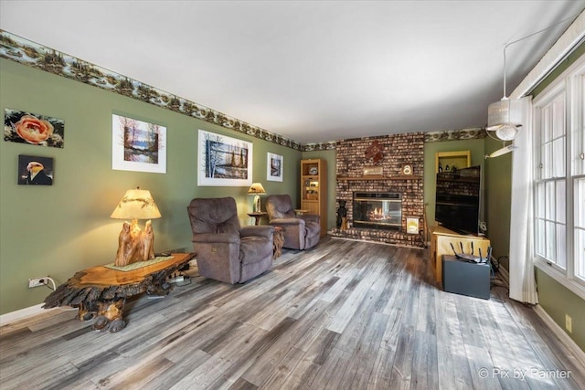 631 Alice Ct, Elgin, IL 60123 - living room featuring wood finished floors, a fireplace, and baseboards
