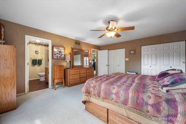 631 Alice Ct, Elgin, IL 60123 - carpeted bedroom with multiple closets, ensuite bath, a ceiling fan, and baseboards